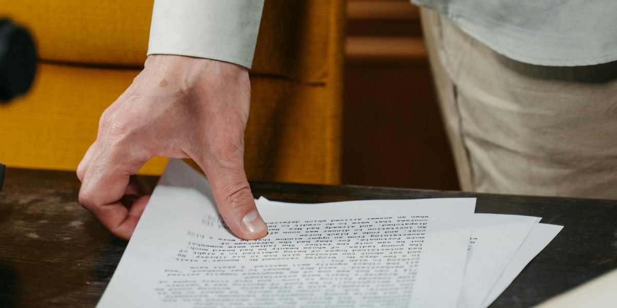 Someone meticulously examining historical documents, uncovering lesser-known details and connections, much like exploring Kubrick's unrealized projects.