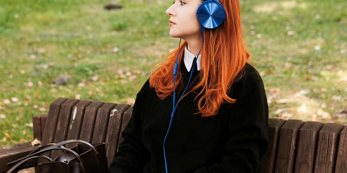 A person enjoying an audiobook while engaged in an outdoor activity, demonstrating how digital tools enhance reading experiences on the go.