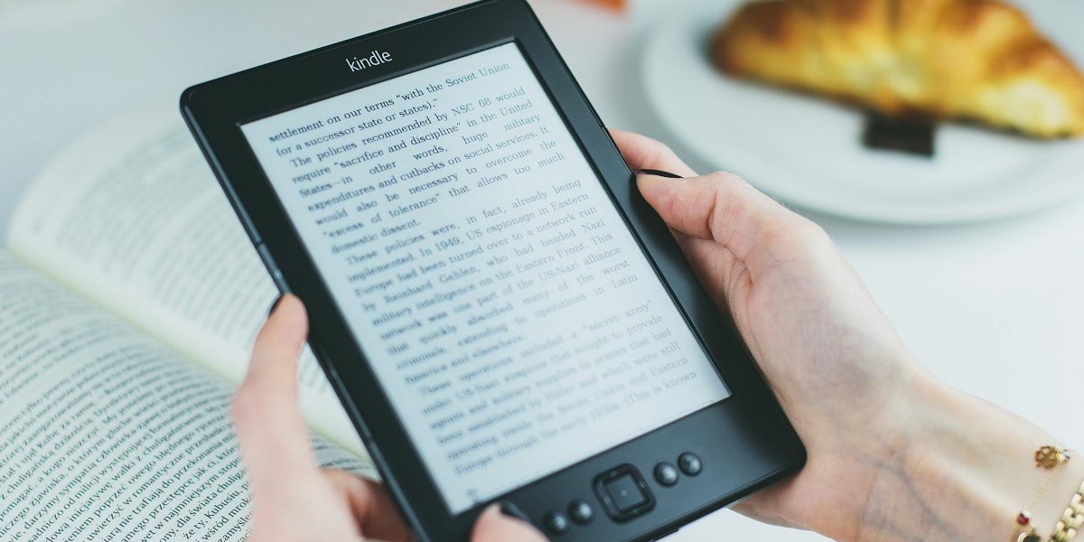 A reader immersed in a digital book, reflecting the joy of discovering new stories.